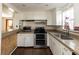 White kitchen cabinets, stainless steel appliances, and granite countertops at 4801 Beach Blvd, Orlando, FL 32803