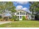 Two-story home with a large front yard and landscaping at 4801 Beach Blvd, Orlando, FL 32803