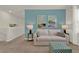 Upstairs sitting area with sofa, ottoman and accent pieces at 684 Preston Cove Dr, St Cloud, FL 34771