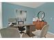 Bright home office features built-in desk and cabinets at 684 Preston Cove Dr, St Cloud, FL 34771