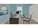 Home office with desk, chairs, and large window with natural light at 684 Preston Cove Dr, St Cloud, FL 34771
