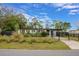 Updated mid-century modern home with a fenced yard and carport at 701 Logan Dr, Longwood, FL 32750