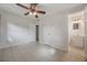 Well-lit bedroom with access to bathroom at 701 Logan Dr, Longwood, FL 32750