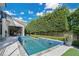 Modern rectangular pool with water features and patio at 1010 N Pennsylvania Ave, Winter Park, FL 32789