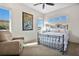 Bright bedroom with a comfortable bed and seating area at 1010 N Pennsylvania Ave, Winter Park, FL 32789