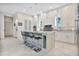 Modern kitchen with white shaker cabinets, a large island, and a marble countertop at 1010 N Pennsylvania Ave, Winter Park, FL 32789