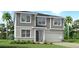 Two-story Craftsman style home with gray siding at 12926 Promise Pl, Orlando, FL 32832