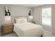 Comfortable bedroom with neutral decor, plush bedding, and natural light at 12926 Promise Pl, Orlando, FL 32832