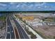 Aerial view of homes under construction near a road and walking path at 1348 Twelve Oaks Rd, Saint Cloud, FL 34771