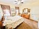 Bedroom with double bed, dresser and ceiling fan at 14650 Sweet Acacia Dr, Orlando, FL 32828