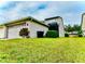 Two-story house with attached garage and well-maintained lawn at 14650 Sweet Acacia Dr, Orlando, FL 32828