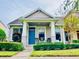 Charming Craftsman style home with a welcoming front porch and landscaping at 14650 Sweet Acacia Dr, Orlando, FL 32828