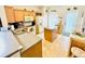 Kitchen with island, wood cabinets, and tile flooring at 14650 Sweet Acacia Dr, Orlando, FL 32828