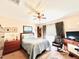 Spacious bedroom with a queen bed and ceiling fan at 14650 Sweet Acacia Dr, Orlando, FL 32828