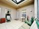 Bright sunroom with screened enclosure and seating at 14650 Sweet Acacia Dr, Orlando, FL 32828