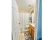 Bathroom with shower, toilet, and wood vanity at 14650 Sweet Acacia Dr, Orlando, FL 32828