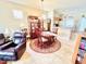 Bright dining room with a wooden table, chairs, and access to the kitchen at 14650 Sweet Acacia Dr, Orlando, FL 32828
