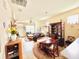 Bright dining room with a round table and access to the living room at 14650 Sweet Acacia Dr, Orlando, FL 32828