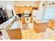 View of kitchen with island and ample counter space at 14650 Sweet Acacia Dr, Orlando, FL 32828