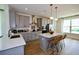 Modern kitchen featuring a large island, stainless steel appliances, and light gray cabinetry at 15076 Grove Lake Dr, Winter Garden, FL 34787