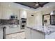 Bright kitchen with double ovens, granite counters, and an island at 17017 Marsh Rd, Winter Garden, FL 34787