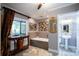 Elegant bathroom featuring a soaking tub and separate shower at 17017 Marsh Rd, Winter Garden, FL 34787