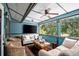 Bright sunroom with comfortable seating and large screen TV at 17017 Marsh Rd, Winter Garden, FL 34787