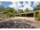 House exterior view with detached garage and spacious yard at 17017 Marsh Rd, Winter Garden, FL 34787