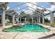Enclosed pool area with spa and tranquil water views at 17017 Marsh Rd, Winter Garden, FL 34787