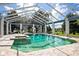 Enclosed pool and spa with a view of the water at 17017 Marsh Rd, Winter Garden, FL 34787