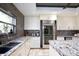 Granite countertops and stainless steel appliances highlight this eat-in kitchen at 17017 Marsh Rd, Winter Garden, FL 34787