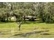 Pond with fountain and fish statue near cottage at 17017 Marsh Rd, Winter Garden, FL 34787