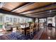 Spacious dining room with wood floors and access to screened porch at 17017 Marsh Rd, Winter Garden, FL 34787
