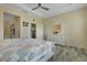 Main bedroom with white dresser and coastal bedding at 171 Silver Maple Rd, Groveland, FL 34736