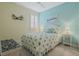 Bedroom with coastal bedding and built-in bench at 171 Silver Maple Rd, Groveland, FL 34736