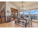 Bright dining room with lake view and rustic wooden table at 2982 Lake Woodward Dr, Eustis, FL 32726