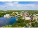 Aerial view of the community with lake and shops at 501 Mirasol Cir # 213, Celebration, FL 34747