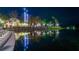 Night view of waterfront reflecting buildings at 501 Mirasol Cir # 213, Celebration, FL 34747