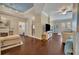 Spacious living room with hardwood floors, fireplace, and large TV at 501 Mirasol Cir # 213, Celebration, FL 34747