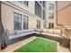 Relaxing patio with sectional sofa and artificial turf at 501 Mirasol Cir # 213, Celebration, FL 34747