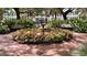 Peaceful courtyard with fountain and flowers at 501 Mirasol Cir # 213, Celebration, FL 34747