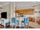 Kitchen boasts granite counters, stainless steel appliances, and breakfast bar at 501 Mirasol Cir # 213, Celebration, FL 34747