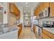 Open concept kitchen with stainless steel appliances and granite counters at 501 Mirasol Cir # 213, Celebration, FL 34747
