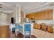 Kitchen with granite countertops, wood cabinets, and breakfast bar at 501 Mirasol Cir # 213, Celebration, FL 34747