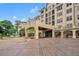 Luxury condo building with attractive landscaping and fountain at 501 Mirasol Cir # 213, Celebration, FL 34747