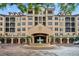 Luxury condo building with attractive landscaping and fountain at 501 Mirasol Cir # 213, Celebration, FL 34747