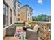 Outdoor patio with seating area and lush landscaping at 501 Mirasol Cir # 213, Celebration, FL 34747