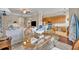 Open concept dining area with glass top table, and kitchen views at 501 Mirasol Cir # 213, Celebration, FL 34747