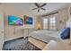 Spacious bedroom with carpeted floors, a large bed, and a TV at 501 Mirasol Cir # 213, Celebration, FL 34747