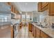 Modern kitchen with stainless steel appliances and granite countertops at 501 Mirasol Cir # 213, Celebration, FL 34747